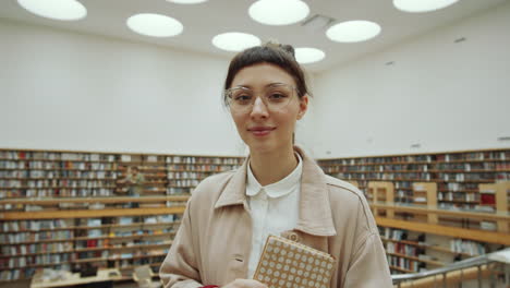 Portrait-of-Young-Positive-Woman-in-Library
